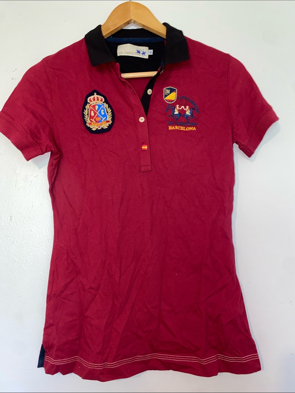 Red Polo Shirt with Black Collar and Embroidered Badges